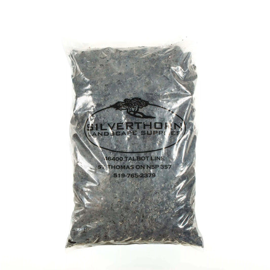 Close-up of Black Lava volcanic decorative stones with charcoal and deep black tones for gardens and pathways