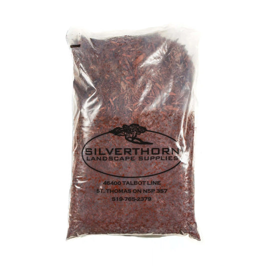 Close-up of Rustic Red Pine Mulch showing uniform texture and rich red color for garden beds and pathways.