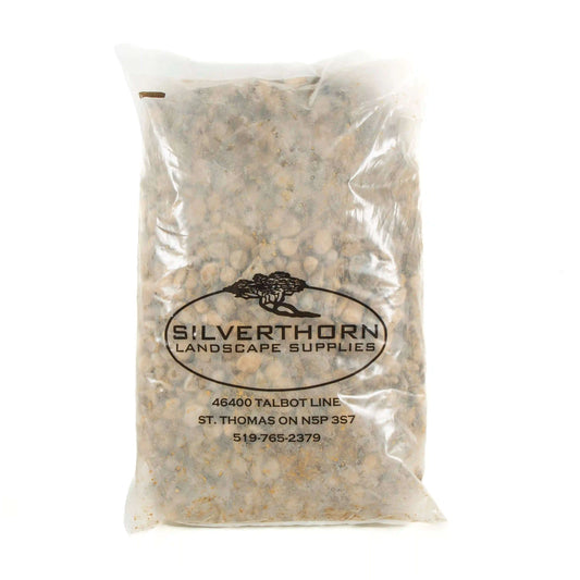 Smooth rounded pond stone in soft buff and grey tones for garden and water features.