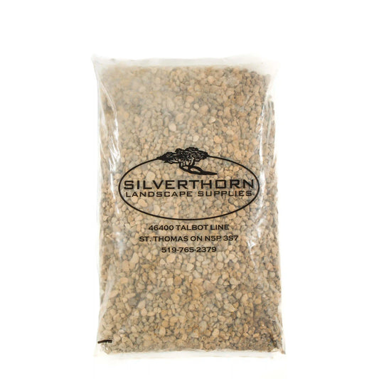 Smooth pea stone decorative gravel in neutral buff and grey tones for pathways and gardens