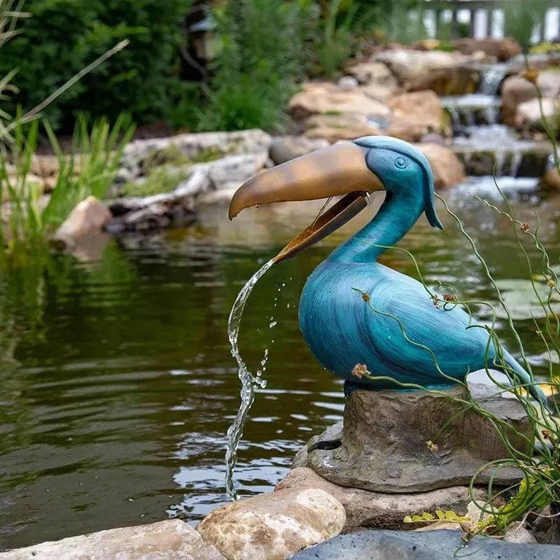 Toucan Spitter polyresin pond ornament with brass finish for outdoor water features