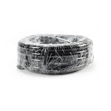 Black vinyl tubing coiled on a white background