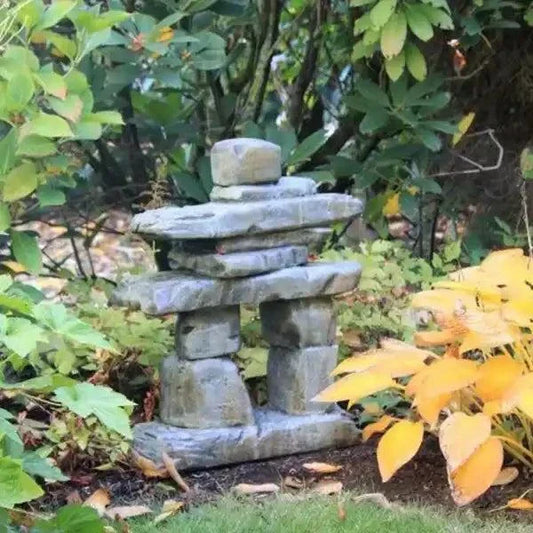Handcrafted Natural Stone Inuksuk symbolizing guidance, strength, and community in a garden setting