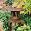 Traditional Japanese Lantern stone garden decoration with soft illumination