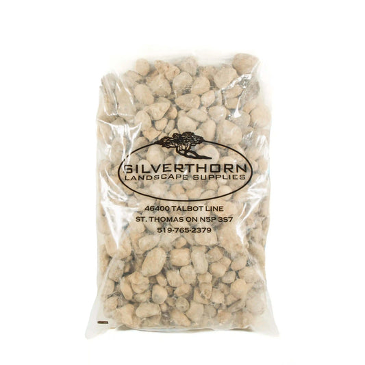 Small River Rock smooth rounded decorative stones in buff and grey tones for garden beds and pathways