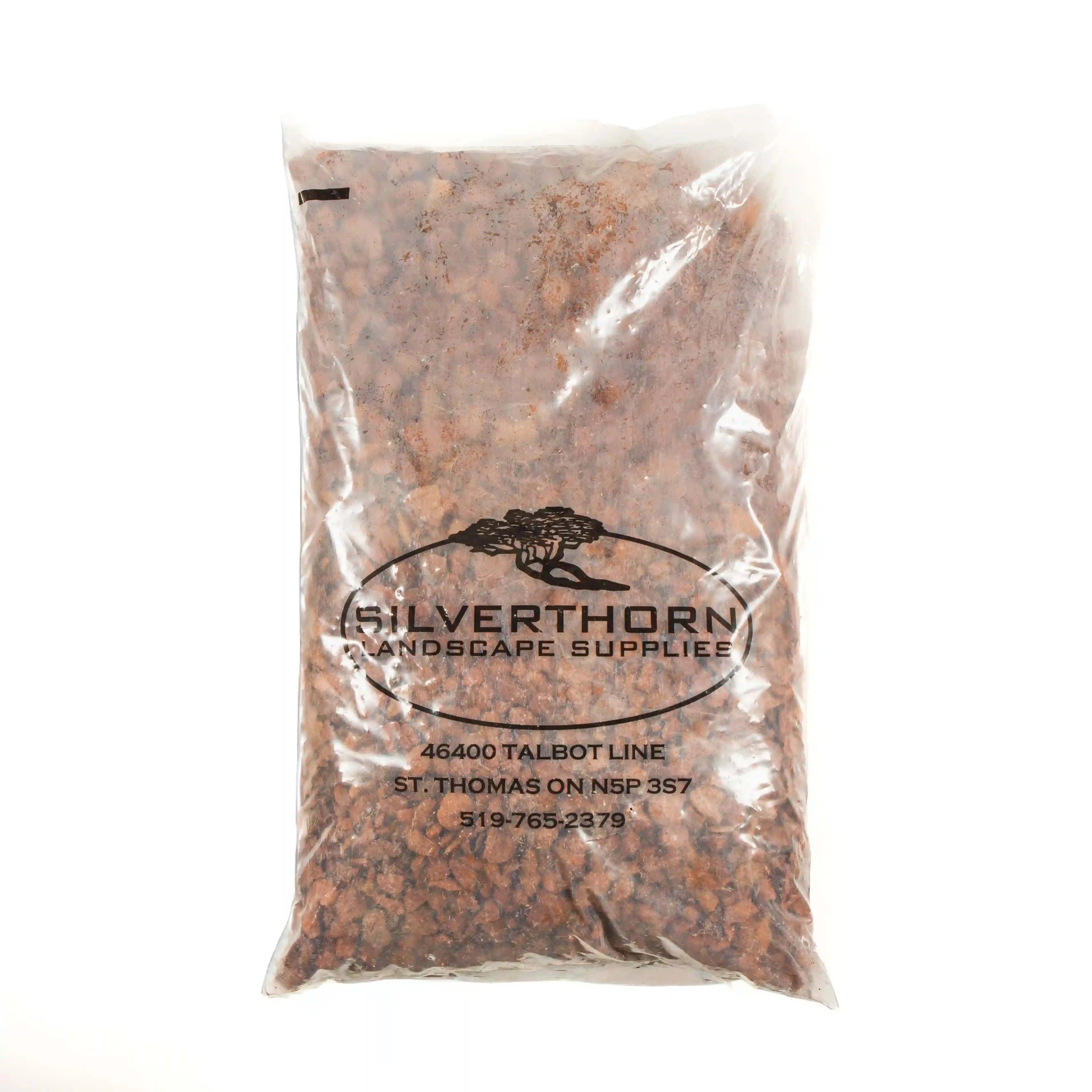 Close-up of 3/4 inch crushed red brick decorative stone for landscaping and pathways