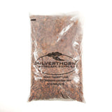 Close-up of 3/4 inch crushed red brick decorative stone for landscaping and pathways