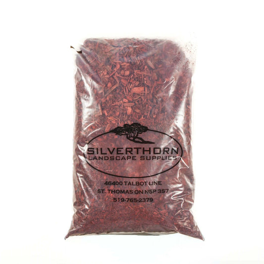 Bright red mulch made from Ontario pine wood for garden beds and pathways