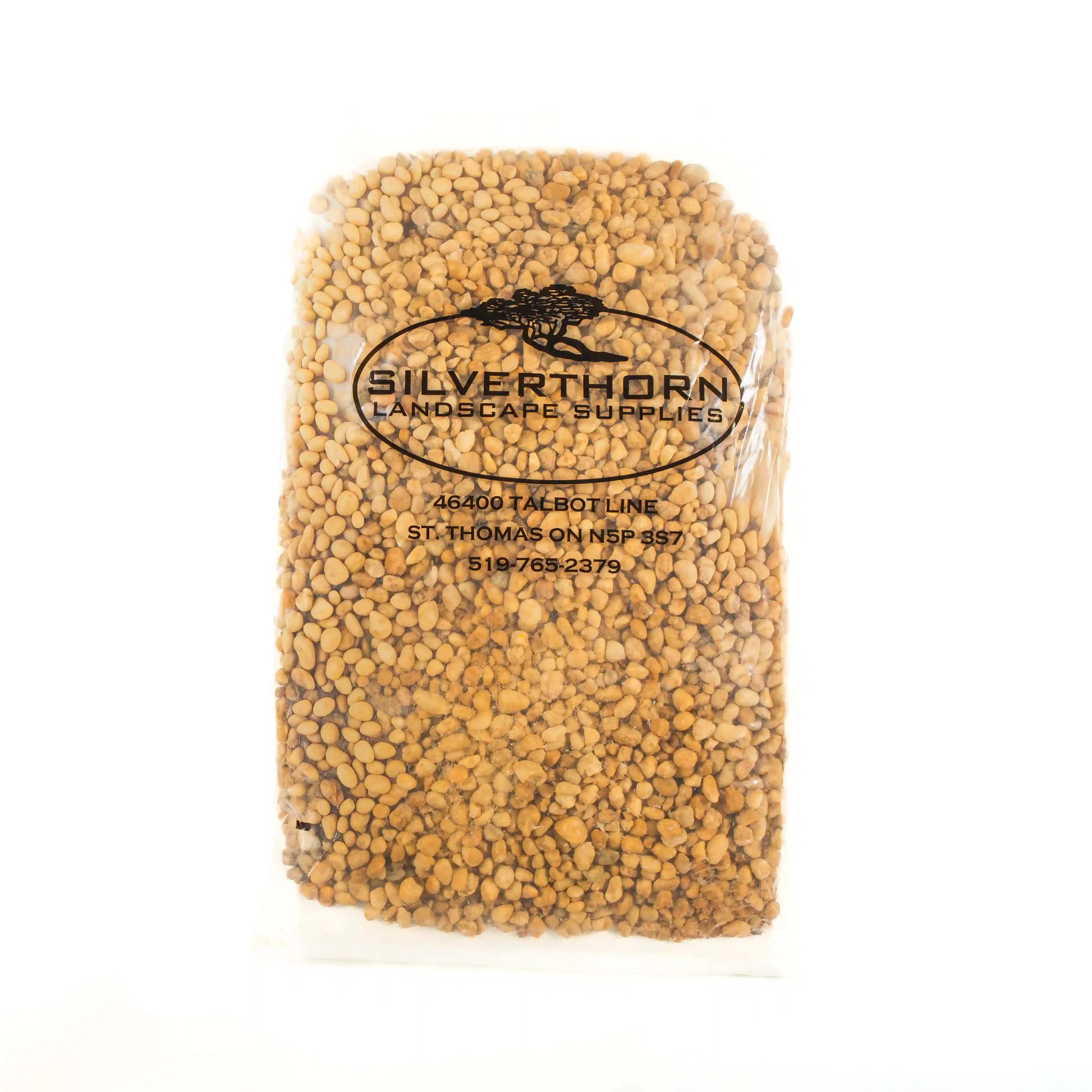 Bag of Coastal Gold Pea Stone decorative natural rounded silica pebbles in warm gold and earthy tones for landscaping