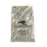 Smokey Sunset decorative crushed granite ground cover in garden bed with smoky grey, pink, and white stones