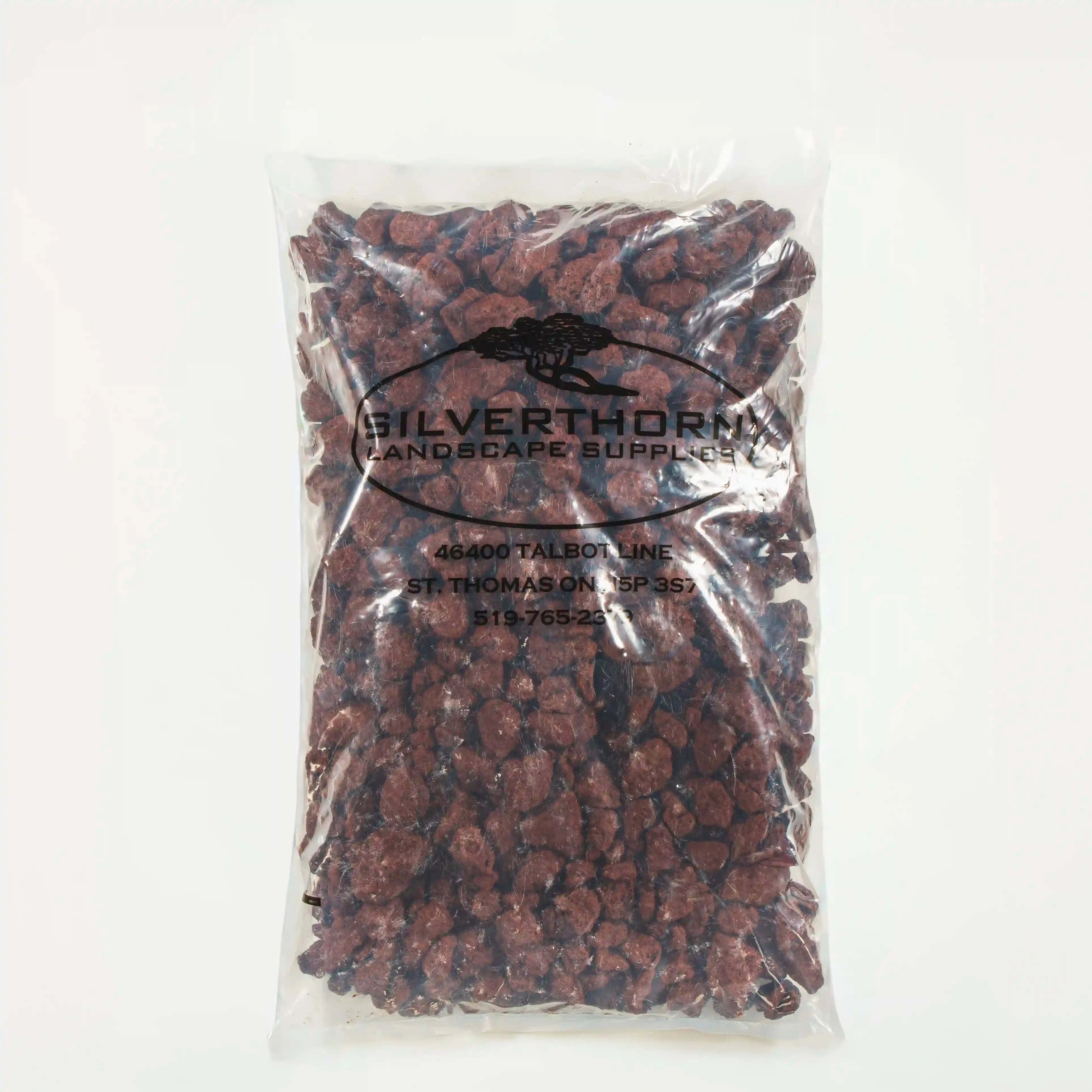 Bag of deep red lava rock stones for gardening and landscaping use