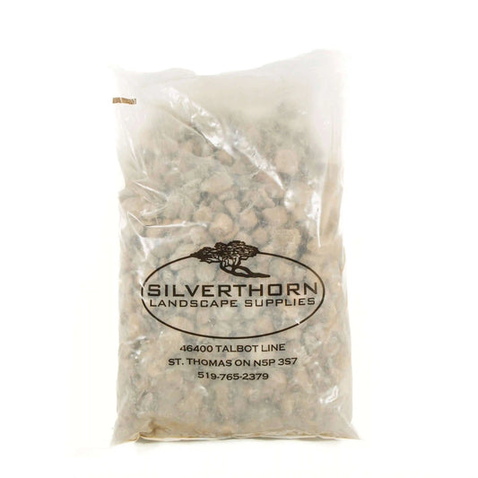 Smooth Algonquin River Stone granite river rocks with natural earthy tones for landscaping